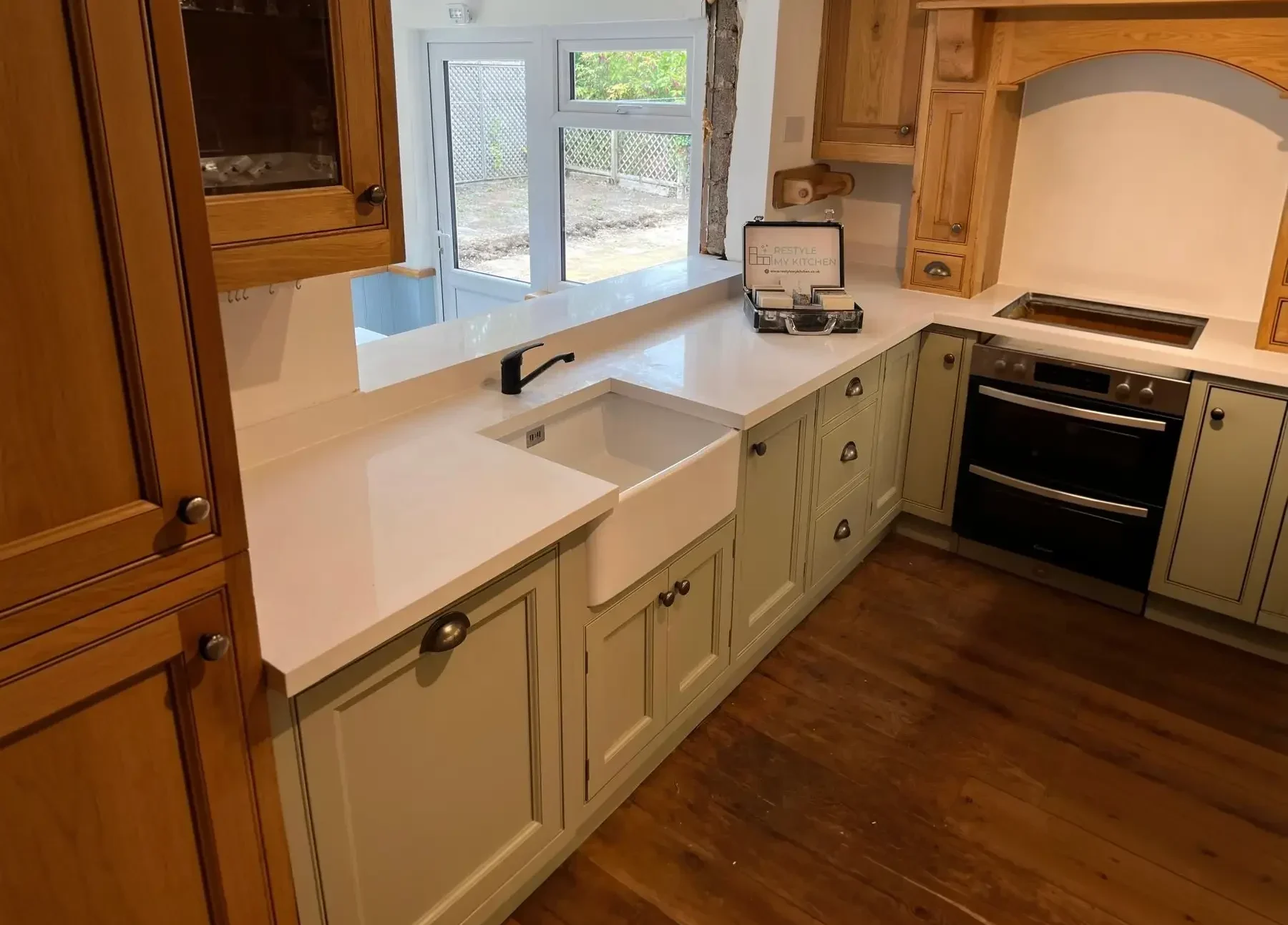 White kitchen worktop overlay fitted around existing cabinets
